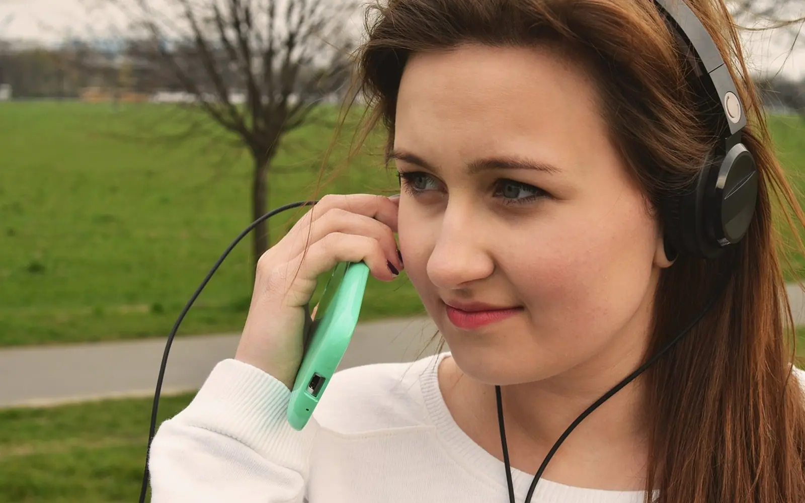 Girl, headphone and smartphone