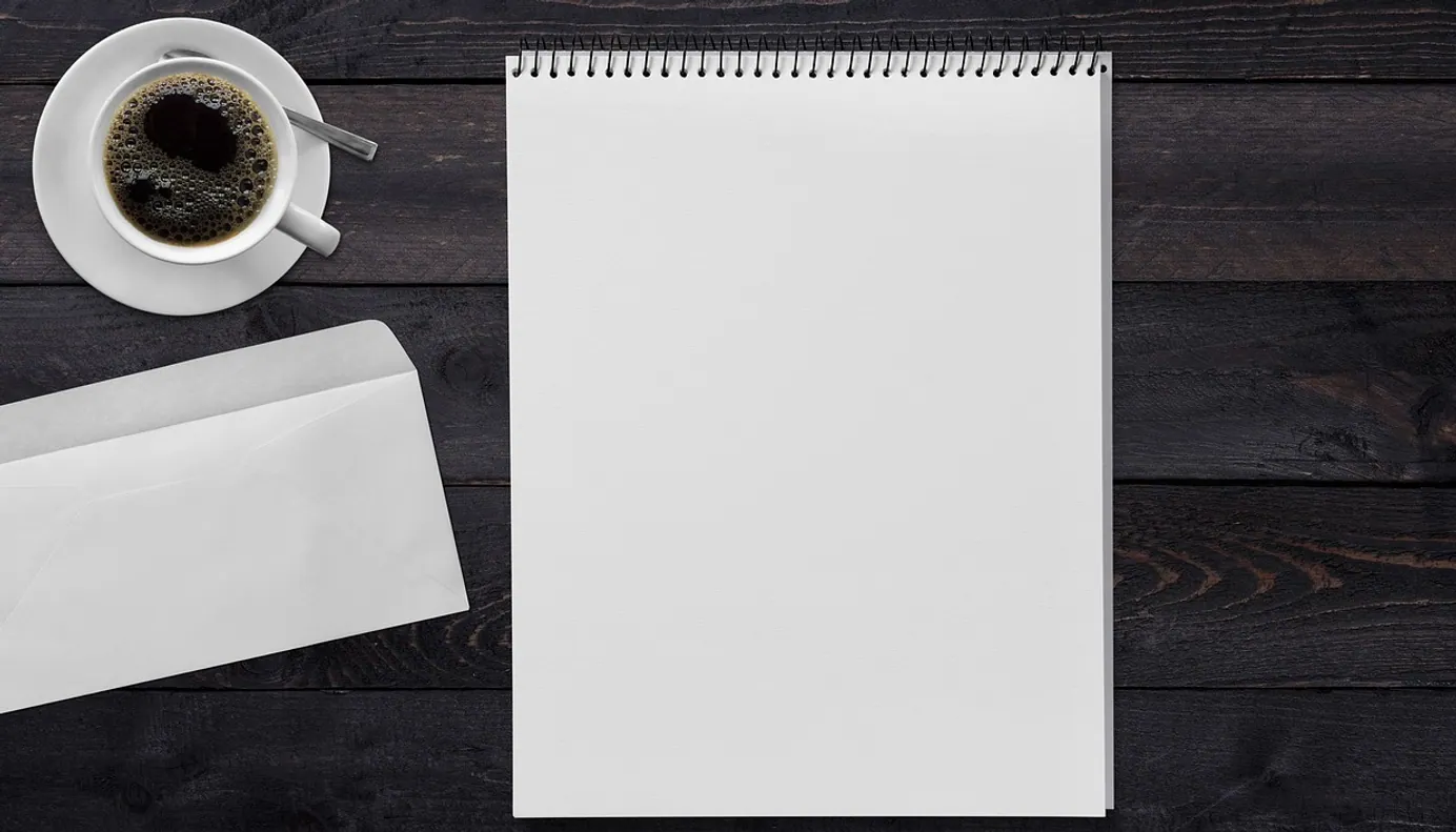 Writing pad, envelope and coffee
